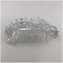 Peineta de estilo remolino con hojas de cristal y ramas con detalle circular 